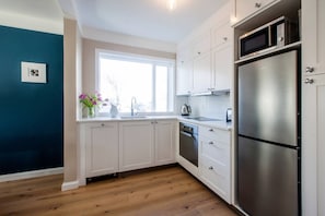 Fully fitted kitchen with a dishwasher