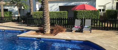 Provided lounge chairs, umbrella with base and very strong WIFI by pool