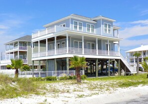 This beautiful home is steps away from the beach and offers lots of deck space and private pool.