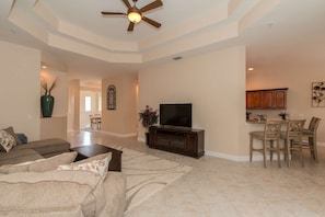 Comfortably furnished open plan living area, perfect for entertaining, complete with large screen TV and cable package.