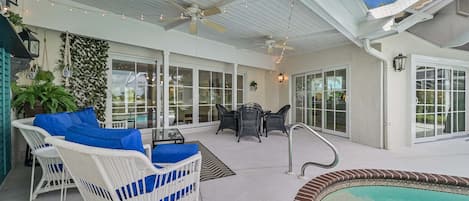 SW28503 - The screened in pool area is equipped with a cabana bathroom, lounge chairs, seating and dining area with BBQ, and offers beautiful lake view!