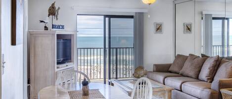 Open living room with breathtaking views of Ormond's serene beach