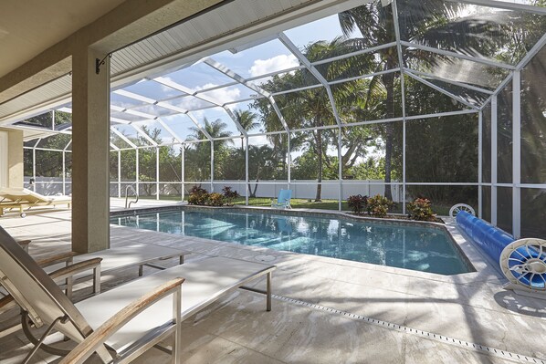 BS3599 - Relax in the private pool or lounge area facing the crystal water and tropical landscaping in your back-yard.