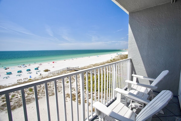 Private balcony overlooking the sand.  Watch dolphins play.