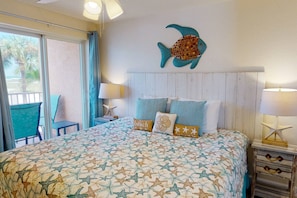 King Bed in Master Bedroom with Balcony Access and En-suite Bathroom.