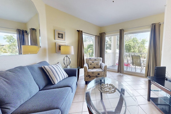 Premium Queen size sleeper sofa in the living room with balcony access