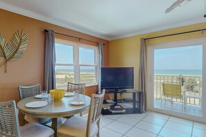 Indoor dining for 4 with a beachfront view