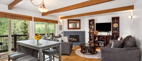 The open floor plan and wall to wall sliding glass doors create a very welcoming retreat when coming to visit Snowmass.