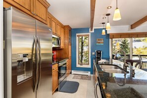 Enjoy the view outside while fixing breakfast in this modern updated kitchen.