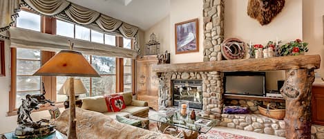 Living Room - Spacious Living Room with Lots of Natural Light, Wood Burning Fireplace