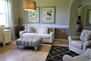 Impecable home design is evident as you step into the entry den, complete with queen memory foam sofa sleeper.