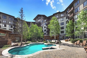 Passage Point has multiple outdoor hot tubs in the backyard area.