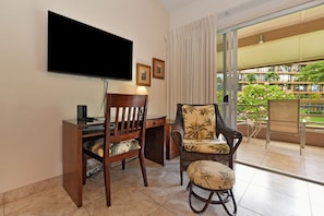 Large flat screen TV in living room as well as a TV in the bedroom upstairs.