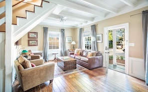 Walk in to exposed rafters and cozy furniture.