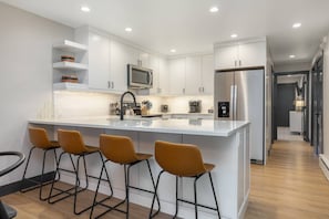 Newly Renovated Kitchen with quartz countertops.