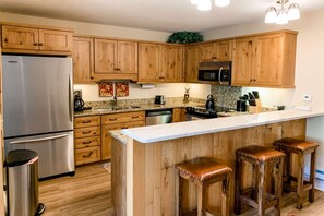 Feel part of the group as you prepare meals in the fully equipped kitchen with granite countertops and stainless steel appliances.