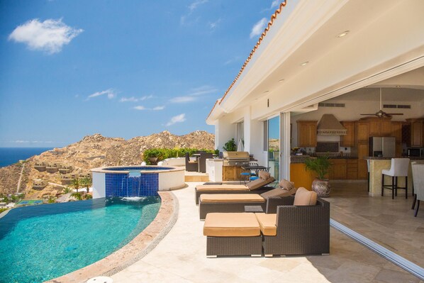 Hot tub, pool, and relaxing seating