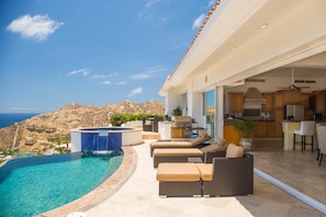 Hot tub, pool, and relaxing seating