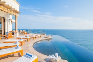 Sunny patio with infinity pool and incredible ocean views