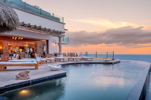 Poolside with ocean views during sunset