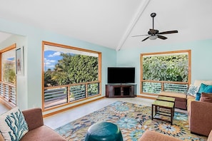 Kahele Kai lving room with ocean view, vaulted ceilings - Kahele Kai, a three bedroom, three bath two story beach home close to Poipu Beach and Brennecke’s Beach.