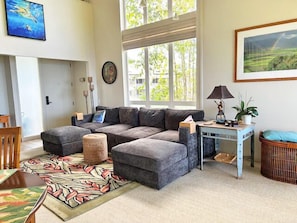 Living area is spacious with high vaulted ceilings