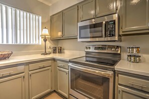 Utilize the modern kitchen with stainless steel appliances.