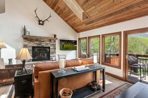Comfortable living room with gas fireplace and beautiful views.