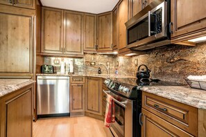 Beautiful, fully equipped kitchen with granite counter tops and stainless appliances.
