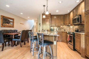 Plan your adventures at the breakfast bar with seating for 3.