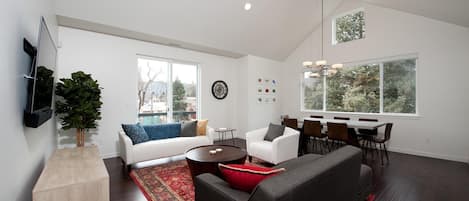 Living room with TV and dining area