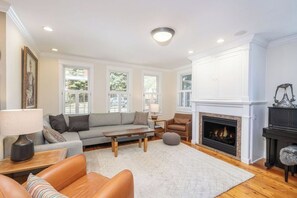 Living area with gas fireplace and flat screen TV (in cabinet above the fireplace).