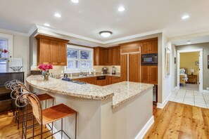 Kitchen - Open kitchen has state of the art appliances and wine cooler