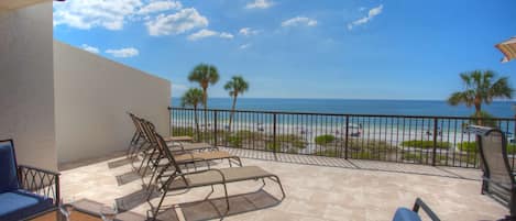 Lounge area overlooking the beach on the patio