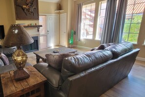 Cozy living room with flat screen TV and decorative fireplace only