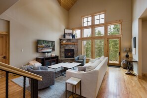 Living Room - Vaulted Ceiling, Fireplace, Smart TV, and Large Windows for Natural Lighting