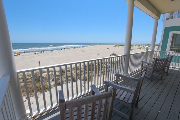 Look out over the beach off the second-floor covered porch!