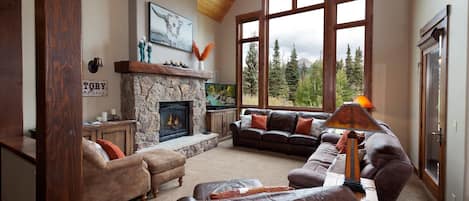 Beautiful vacation rental located just across the street from Purgatory Resort in Durango, CO. Living room with Engineer Mountain views and fireplace.