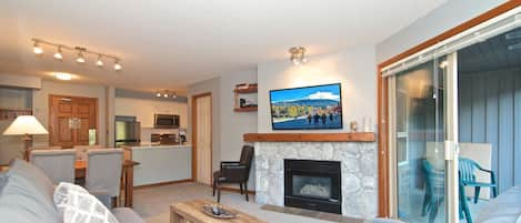 Open plan, gas fireplace , wall mounted TV