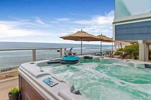 Enjoying a Relaxing Soak in the Jacuzzi While Watching the Waves