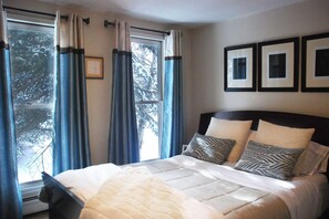 The tranquil bedroom is a cozy and comfortable place to rest your head after a long day out in the fresh mountain air.