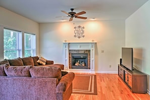 Cozy up in the den area with a fireplace and 55-inch flat-screen TV.