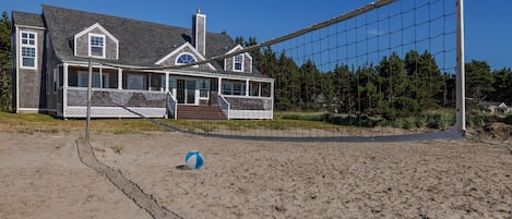 Private sand volleyball court just steps from the wraparound porch and open skies