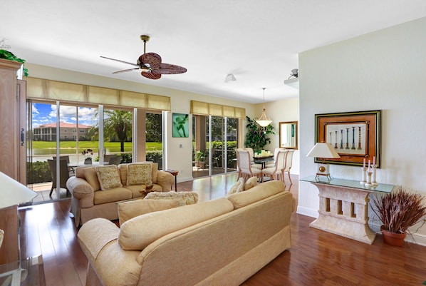 VY693-16B - The elegant decorated living with flat screen TV offers a beautiful lake view