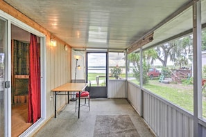 Enjoy the tranquil lake views from this screened-in porch.