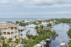 Watch the sunset over stunning waterfront homes on the Gulf and canal, just outside your lanai patio.