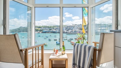 Two Harbour House, right on the Wharf seafront of St Ives overlooking the harbour and beach. Allocated parking in garage. Free WiFi.