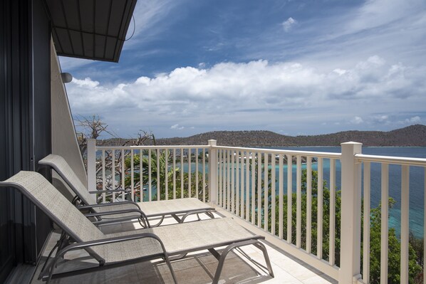 Large balcony with lounge chairs for taking in the views.