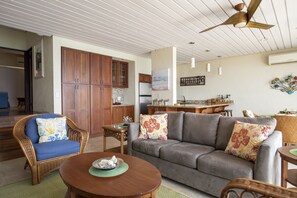 Living area has lots of comfortable seating for relaxing after a day at the beach.