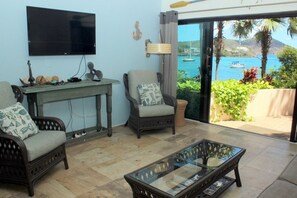 Large flat screen TV in living area and amazing views.